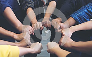 Group of business team work join their hands together with power and successful