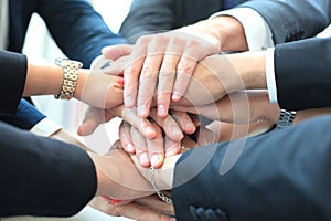 Group of businessman team touching hands together. Selective focus.