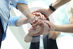 Group of businessman team touching hands together. Selective focus.