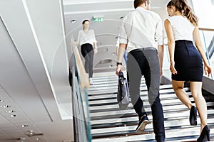 Group of businessman walking and taking stairs