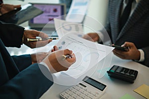 group businessmen and investors met together in conference room to view annual results their investments in business together in