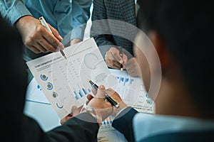 group businessmen and investors met together in conference room to view annual results their investments in business together in