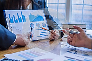 group businessmen and investors met together in conference room to view annual results their investments in business together in