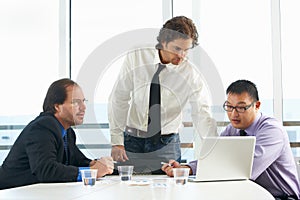 Group Of Businessmen Meeting In Office