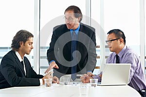 Group Of Businessmen Meeting In Office