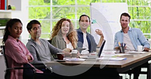 Group of businessmen sit and looking to camera.