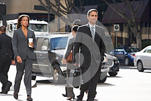 Group Of Businesspeople Crossing Street