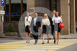 Group Of Businesspeople Crossing Street