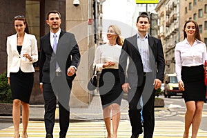 Group Of Businesspeople Crossing Street