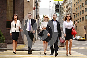 Group Of Businesspeople Crossing Street