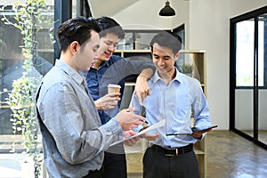 Group of businesspeople discussing startup project sharing business ideas chatting during coffee break in office