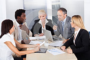 Group of businesspeople discussing together
