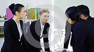 Group of businesspeople discussing together at meeting room