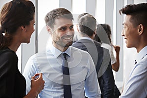 Group Of Businesspeople Having Informal Office Meeting