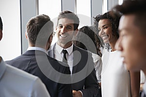 Group Of Businesspeople Having Informal Office Meeting