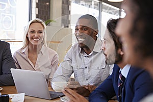 Group Of Businesspeople Having Meeting In Coffee Shop