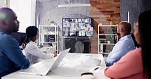 Group Of Businesspeople Having Video Conference