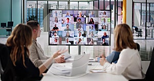 Group Of Businesspeople Having Video Conference photo