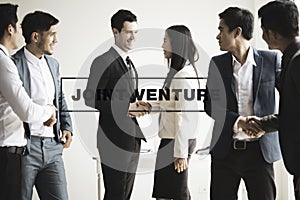 Group of businesspeople making handshake in office. joint venture concept.