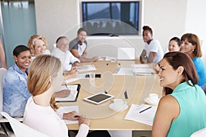 Group Of Businesspeople Meeting In Boardroom