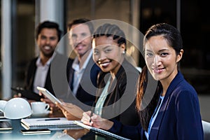 Group of businesspeople sitting in a meeting