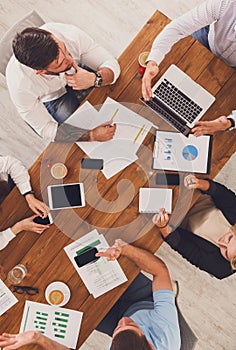 Group of busy business people working in office, top view