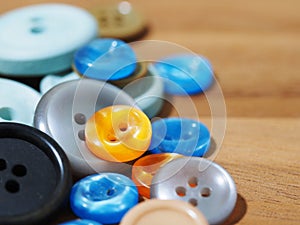 group of button studs on wooden background