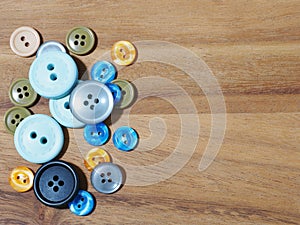 group of button studs on wooden background