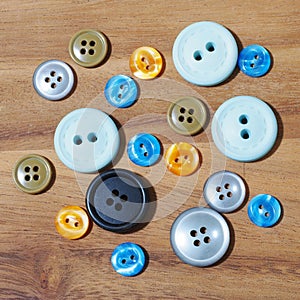 group of button studs on wooden background