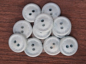 Group of buttons on the wooden table