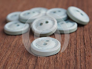 Group of buttons on the wooden table