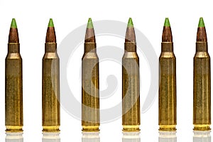 A group of 5.56 calibar, green tip bullets ordered into the line photo