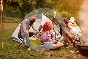 Group of campers photographing selfie in nature