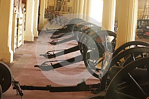 Group of cannons placed in order at corridor