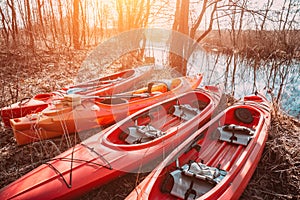 Group of canoes rental kayak on the lake shore beach
