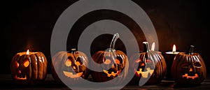 group of carved jack - o\' - lanterns with candles flickering inside, casting spooky shadows Halloween scene