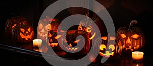group of carved jack - o\' - lanterns with candles flickering inside, casting spooky shadows Halloween scene