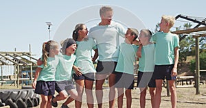 Group of Caucasian boys and girls at boot camp together