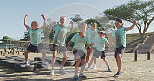 Group of Caucasian children training at boot camp