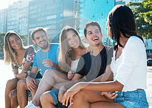 Group of caucasian and hispanic young adults has fun photo