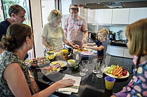 Group of caucasian people preparing barbecue party in the kitche