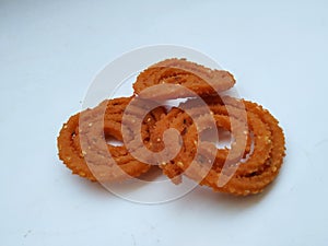 Group of Chakli isolated on White Background. Indian Snack Chakli or chakali made from deep frying portions of a lentil flour