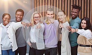 Group of cheerful business people in casual wear standing close