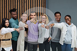 Group of cheerful business people in casual wear standing close