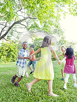 Group of Cheerful Children Playing in the Park