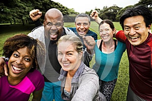 Group of cheerful diverse friends in the park