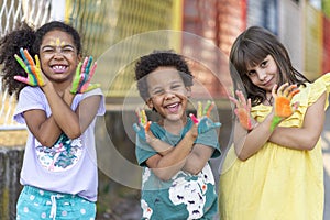 group of cheerful multicultural children playing together photo