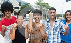 Group of cheering multi ethnic man and woman in New York City