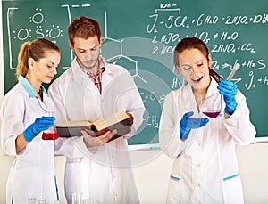 Group chemistry student with flask.