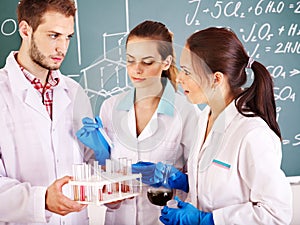 Group chemistry student with flask.